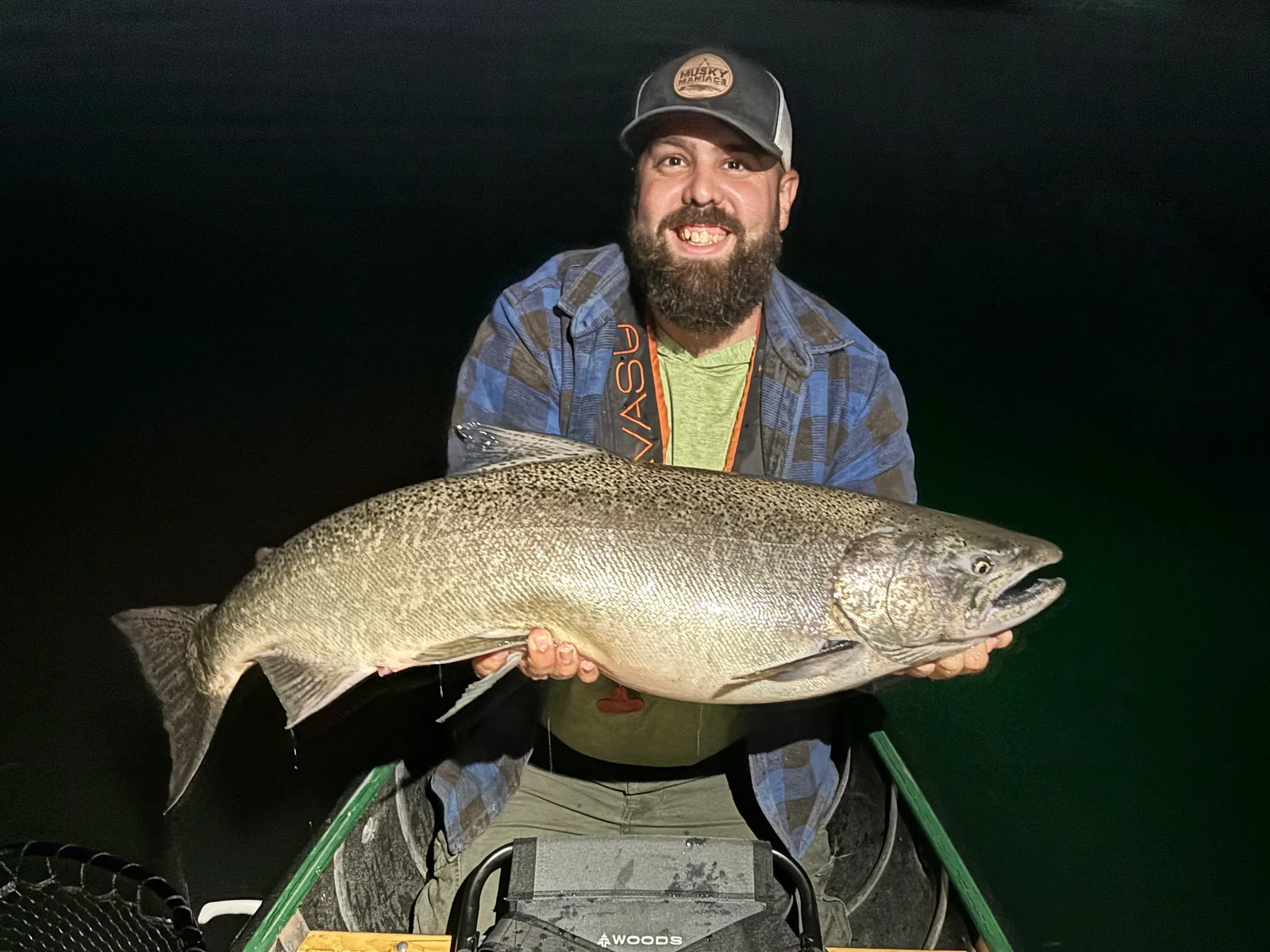 Andrew from Fishing Loons holding a chinook salmon while fishing.