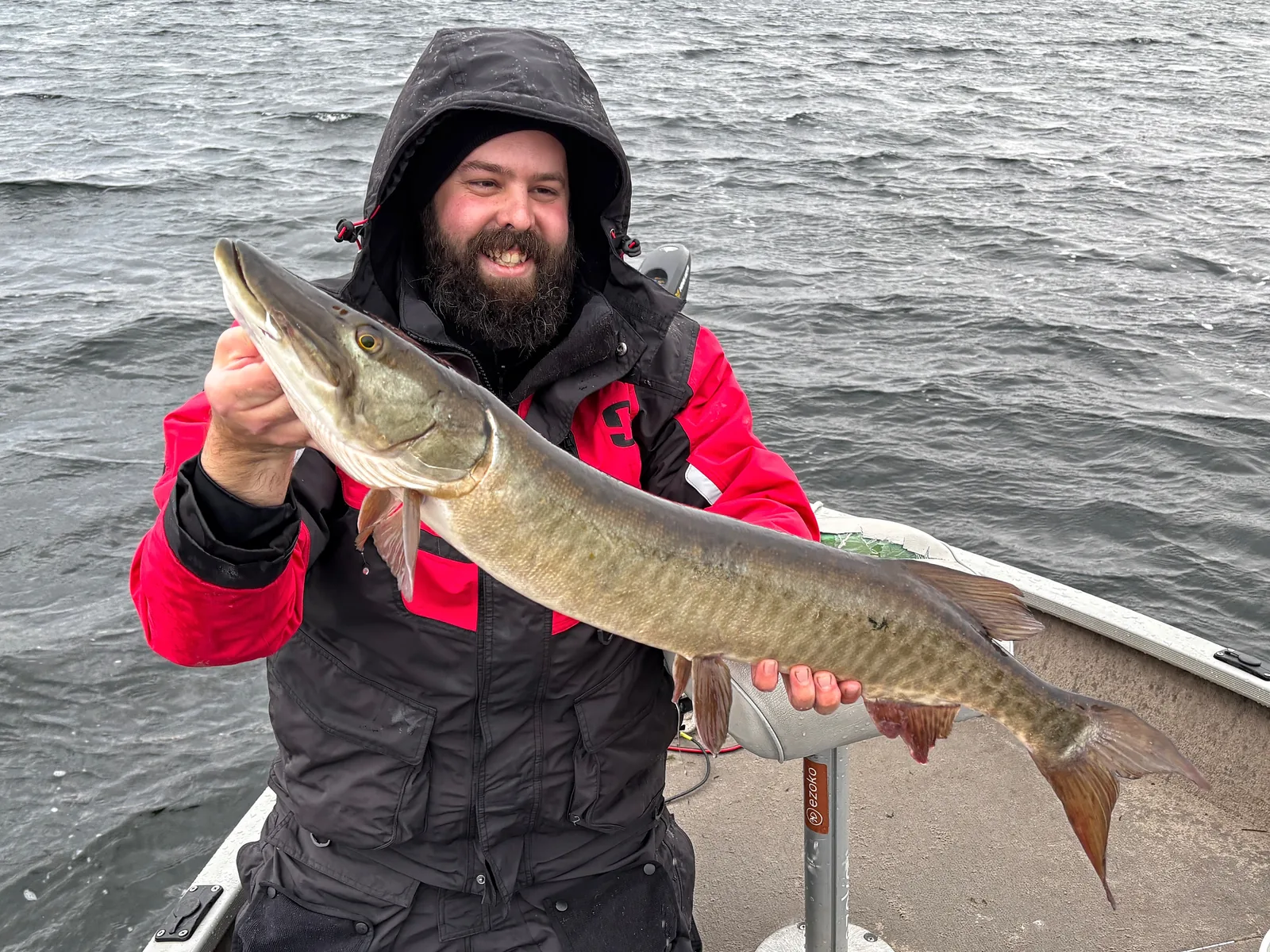 Andrew from Fishing Loons holding a muskie while fishing.