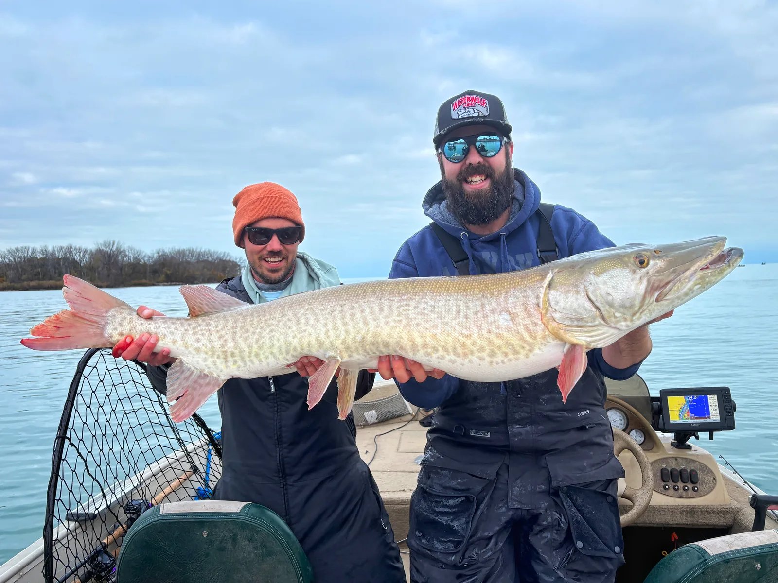 Andrew from Fishing Loons holding a muskie while fishing.